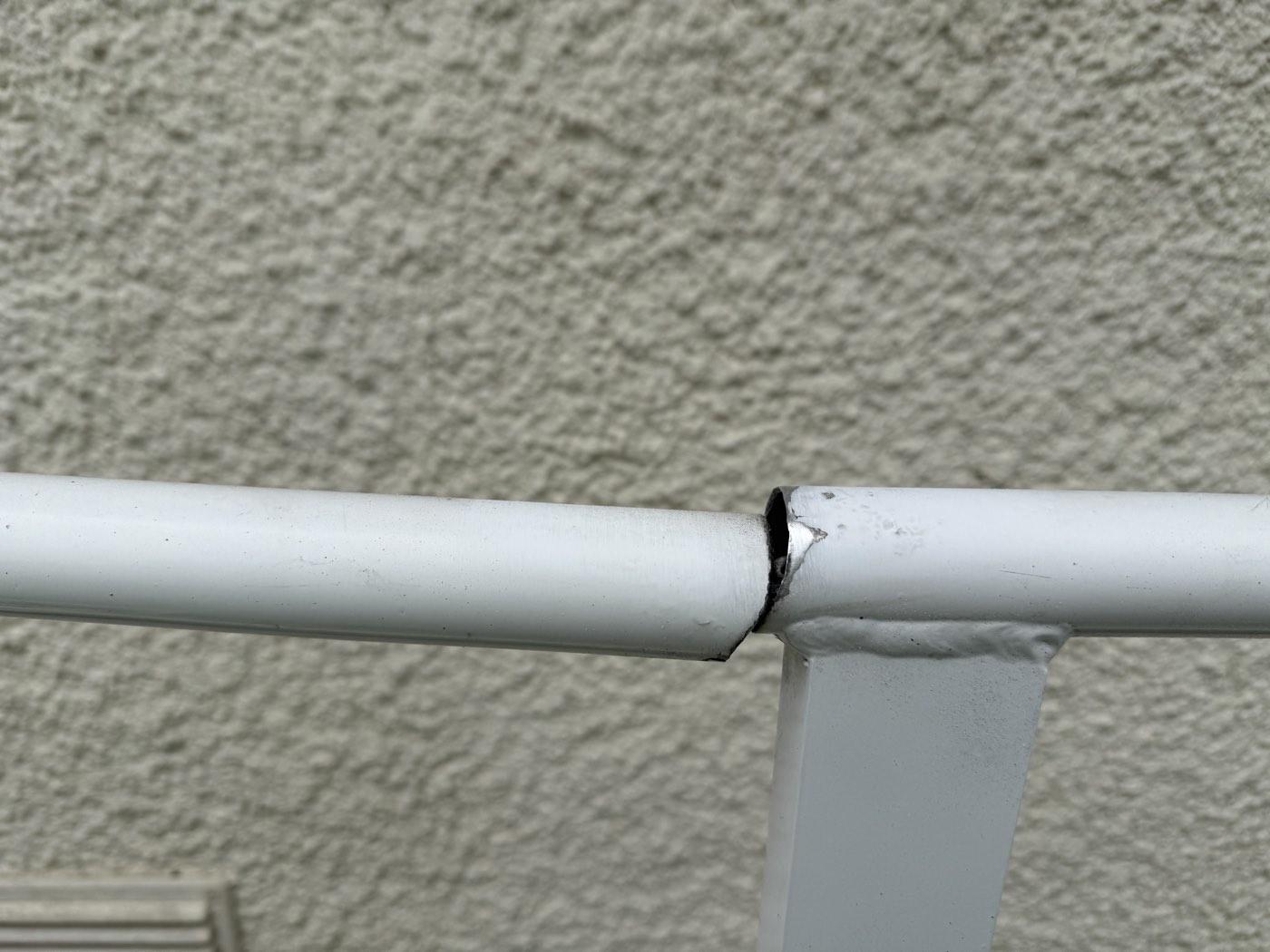 Before: a broken handrail joint