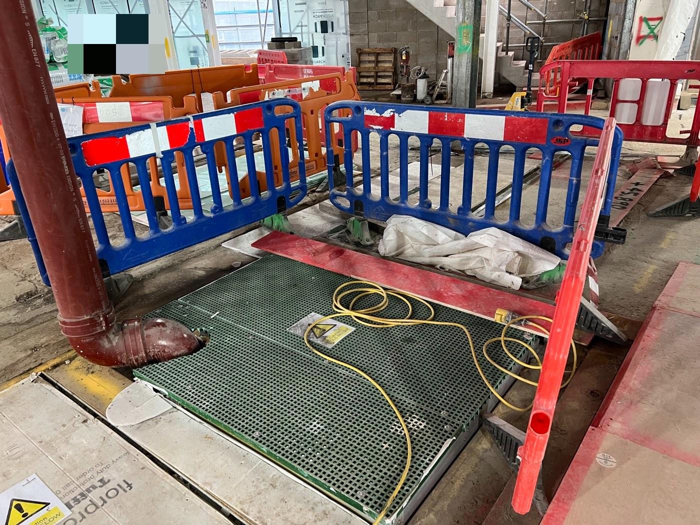 A floor opening covered and made safe