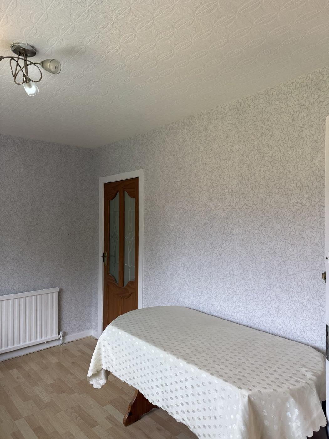 After: neat wallpaper hanging around the door
