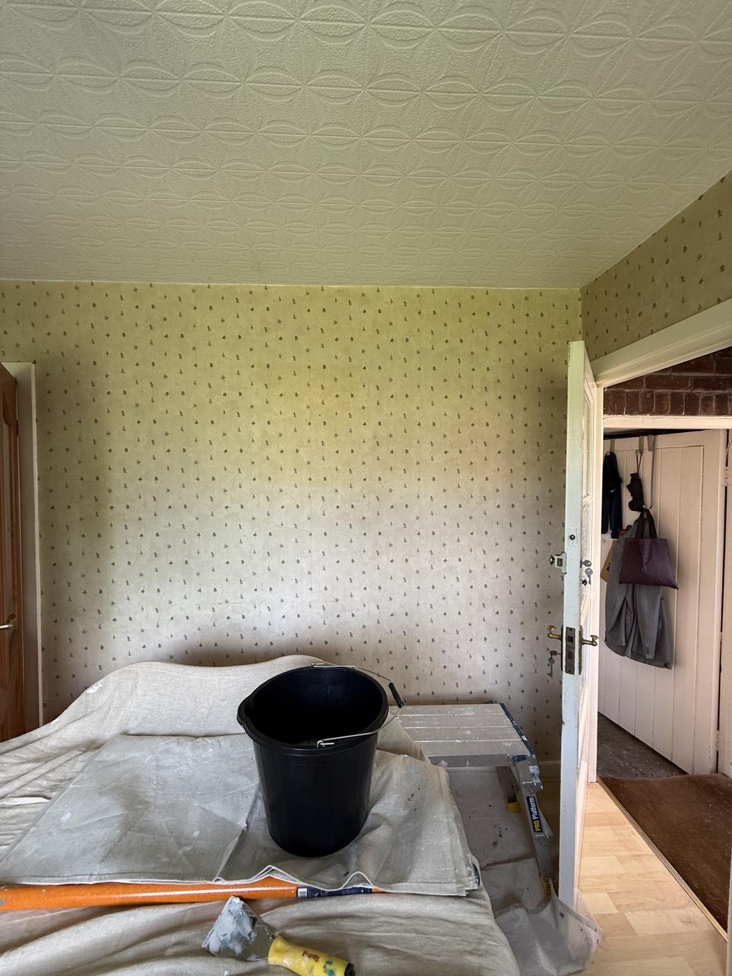 Before: the old patterned wallpaper