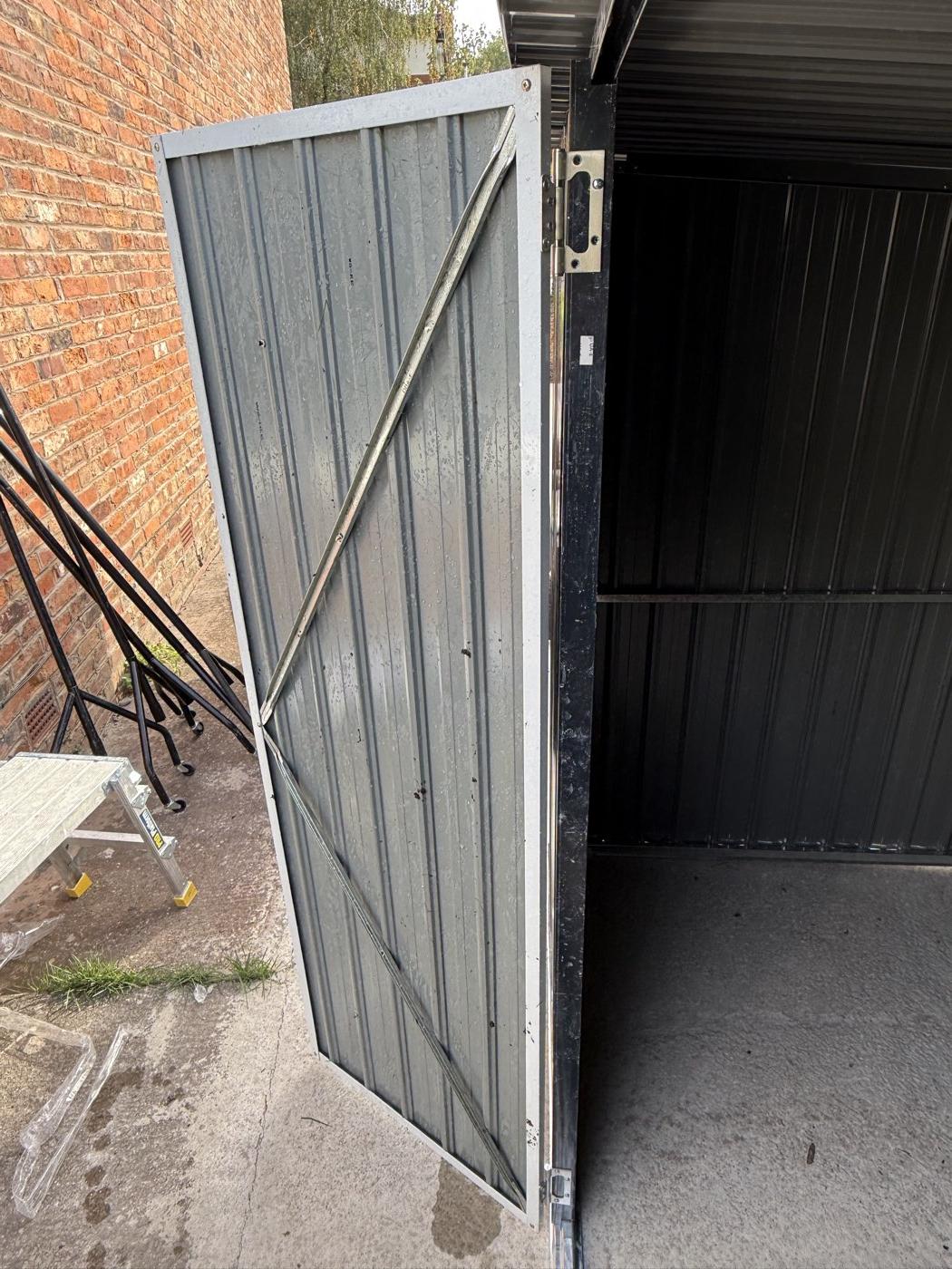 Inside, with the door braced and aligned