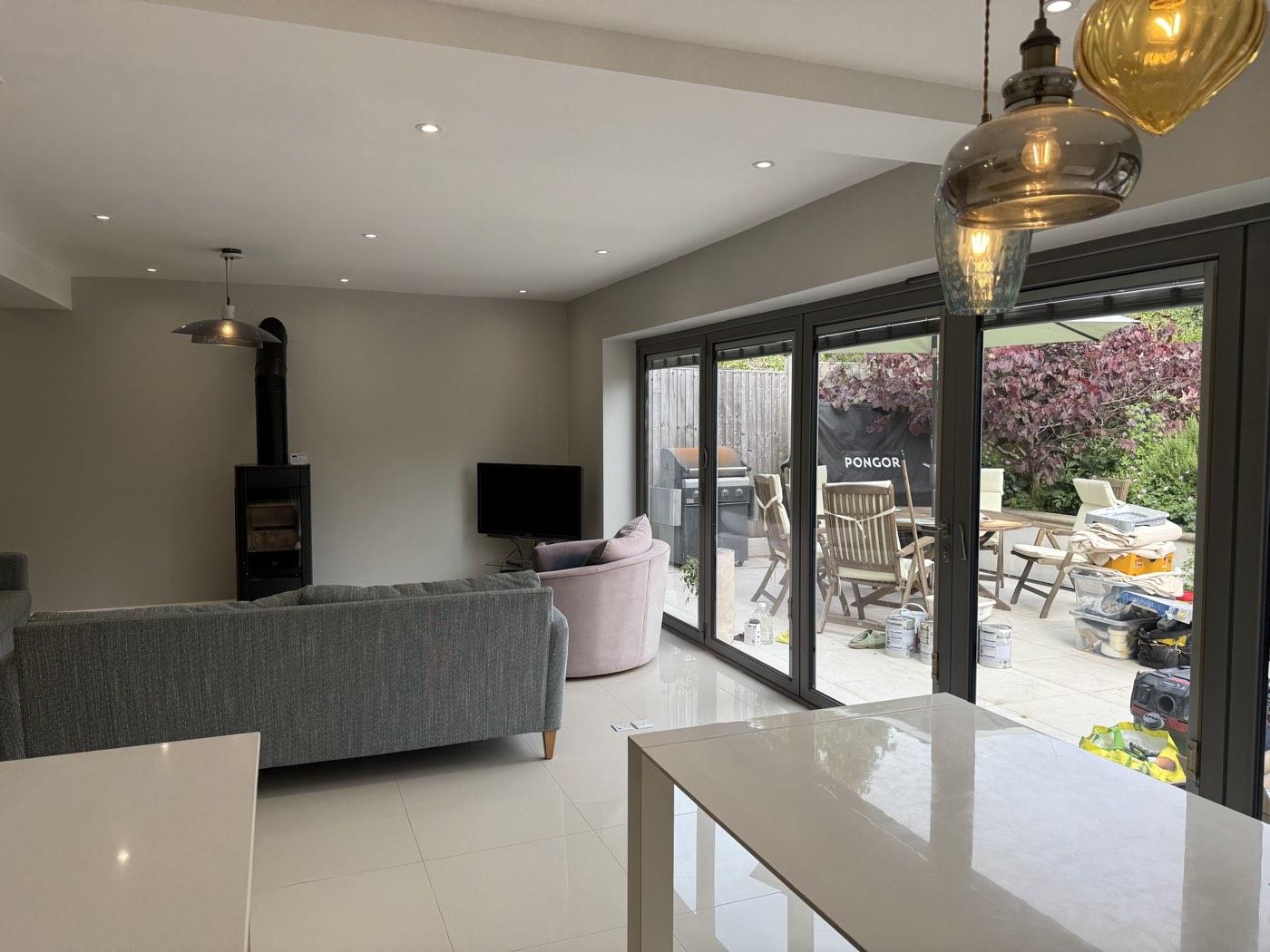 After: lounge and bi-fold doors opening onto the garden