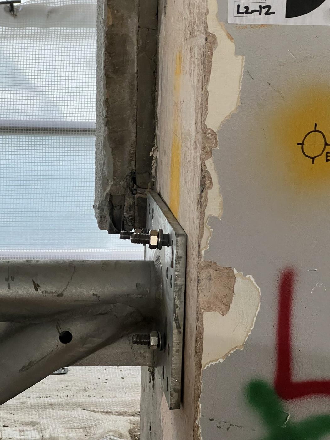 Close-up: a connection plate secured with mechanical fixings
