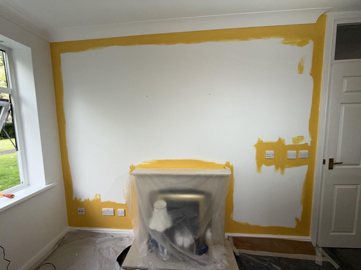 Cutting in the feature wall, with the fireplace fully protected